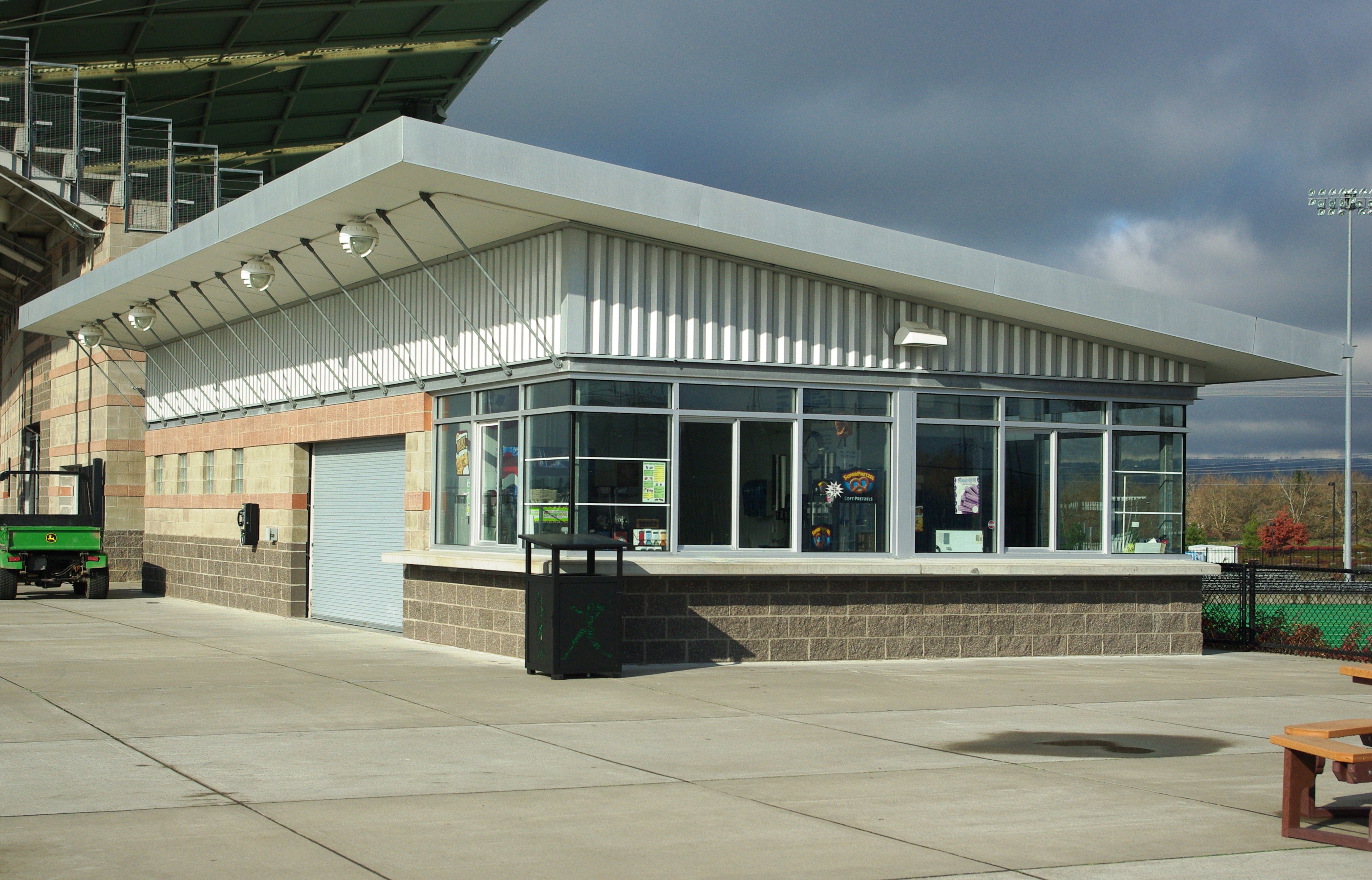 A sports-ground canteen with food service windows and outdoor seating